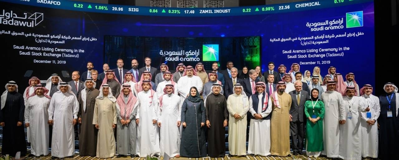Saudi Aramco and Tadawul top officials are seen during the first day of oil giant's trading on Wednesday in Riyadh. 
