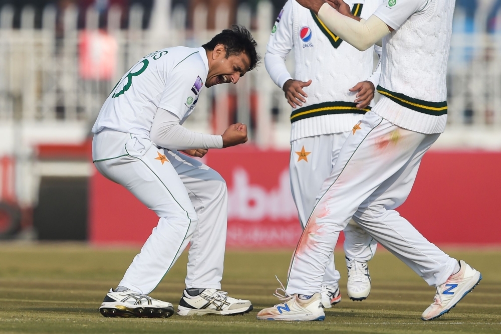 Pakistan's Mohammad Abbas celebrates after bowing out Sri Lanka's Dinesh Chandimal, not pictured, during the first day of the first Test cricket match between Pakistan and Sri Lanka at the Rawalpindi Cricket Stadium in Rawalpindi, Pakistan, on Wednesday. — AFP