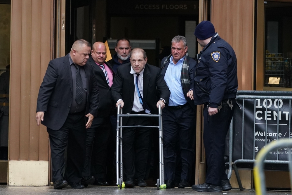 Harvey Weinstein leaves Manhattan Criminal Court, using a walker, following a hearing in New York on Wednesday. — AFP