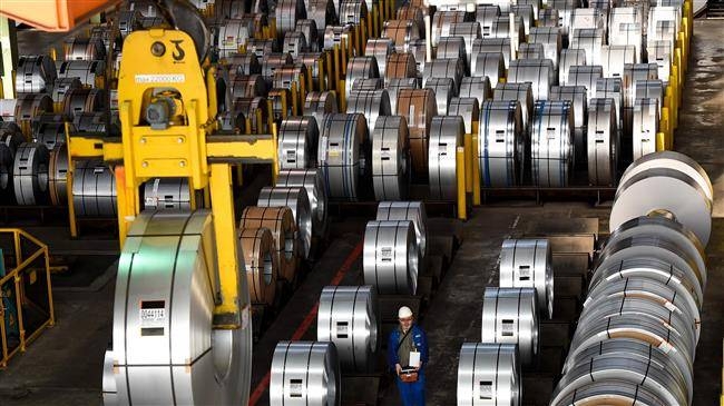 A worker packs coils for delivery at the production site of German steel technology group Salzgitter AG in Salzgitter, Germany, in this March 17, 2015 file photo. — AFP