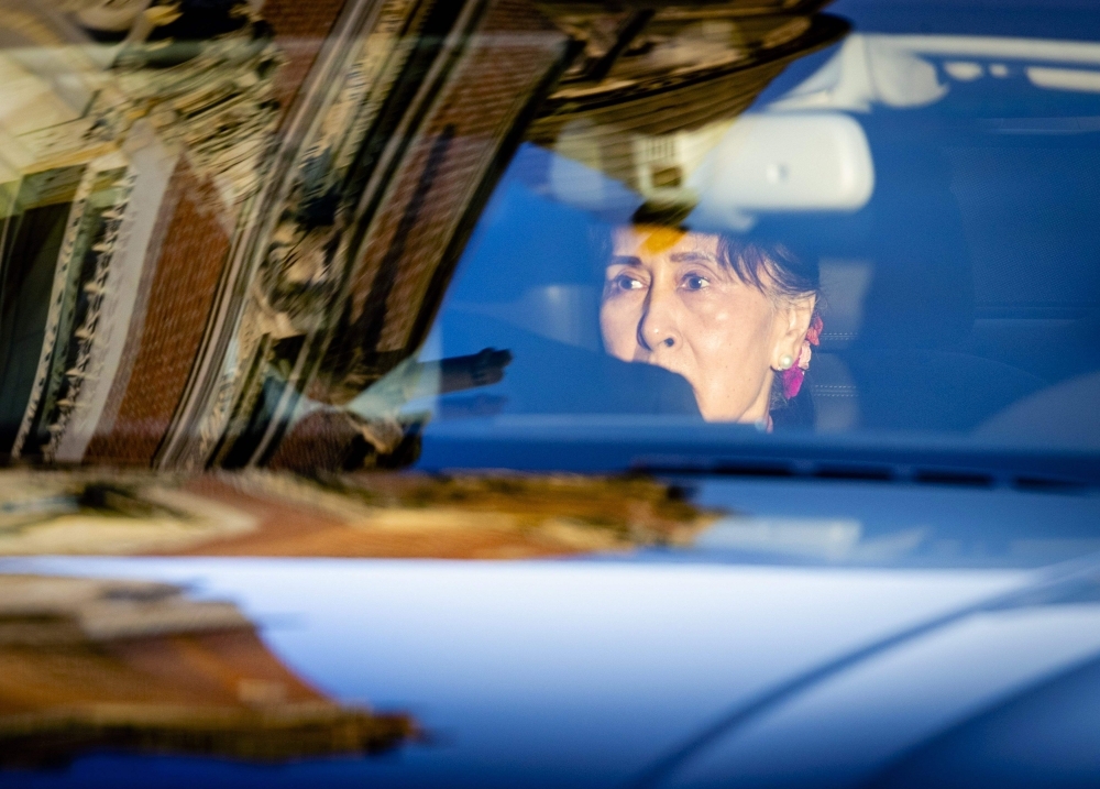 Myanmar's State Counsellor Aung San Suu Kyi arrives in a car on the last day of hearing on the Rohingya genocide case before the UN International Court of Justice at the Peace Palace in The Hague on Thursday. — AFP