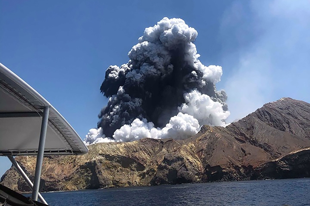 A plume of ash rises into the air as the volcano on White Island erupts off the coast of Whakatane on New Zealand's North Island in this Dec. 9, 2019 file photo. — AFP