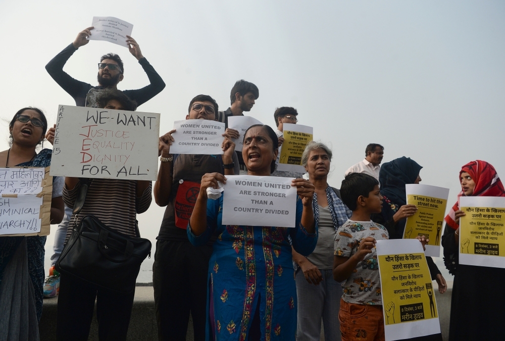 Activists and supporters hold placards and shout slogans to protest against the alleged rape and murder of a 27-year-old veterinary doctor in Hyderabad in Mumbai in this Dec. 8, 2019 file photo. — AFP
