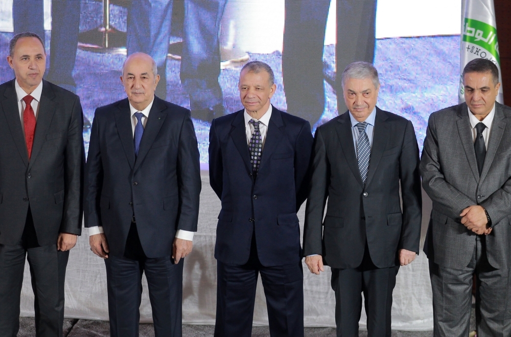Algerian presidential candidates Former Culture Minister Azzedine Mihoubi, left, former Prime Minister Abdelmadjid Tebboune, second left, former Tourism Minister Abdelkader Bengrina, center, former Prime Minister Ali Benflis, second right, and the head of the Mostakbal Movement party, Abdelaziz Belaid, right, stand together during a press conference after signing a charter of ethics in the capital Algiers in this Nov. 16, 2019 file photo. — AFP