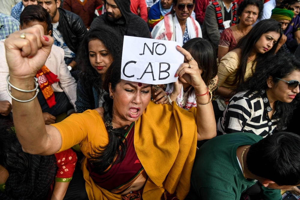 Demonstrators shout slogans during a protest against the government's Citizenship Amendment Bill (CAB) in Guwahati, Assam, on Friday. — AFP