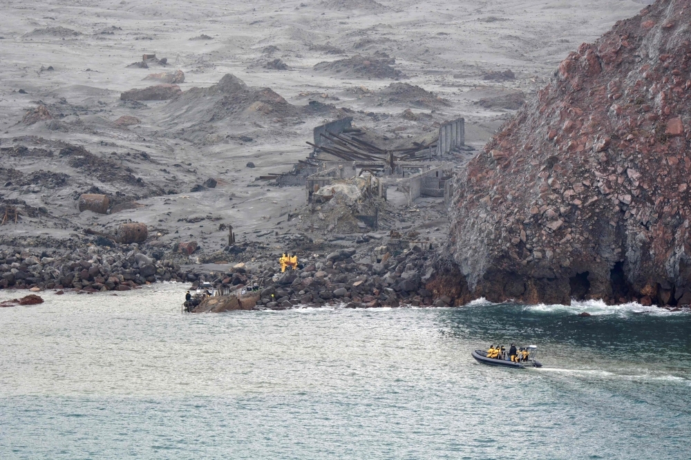 This handout photo released on Friday by the New Zealand Defense Force shows elite soldiers taking part in a mission to retrieve bodies from White Island after the Dec. 9 volcanic eruption, off the coast from Whakatane on the North Island. — AFP