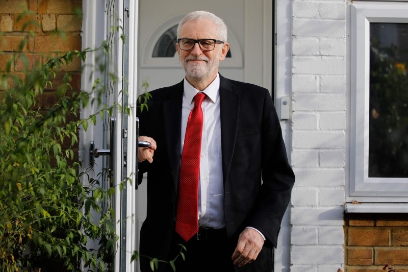 Opposition Labour party leader Jeremy Corbyn leaves his home in north London on Friday. — AFP
