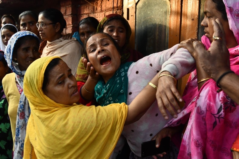 Relatives of Sam Stafford, 18, who was killed after police fired during a protest against the government's Citizenship Amendment Bill (CAB) a day before, react in Guwahati, Assam, on Friday. — AFP