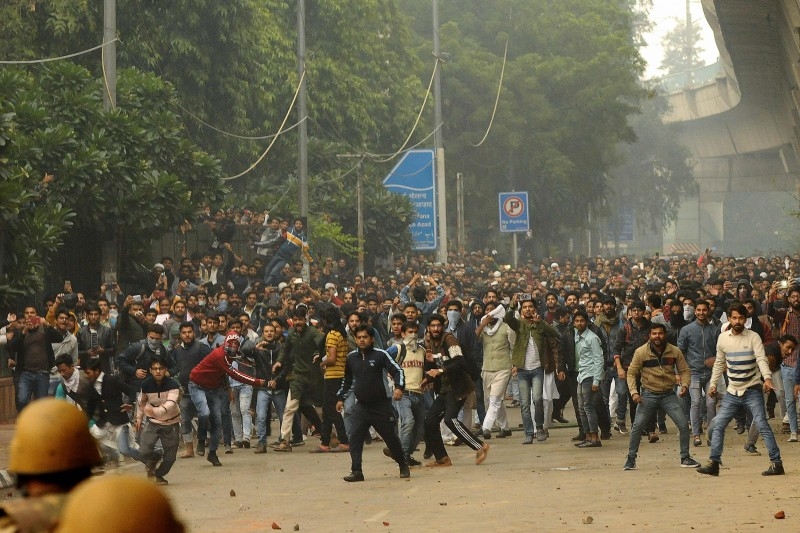 Relatives of Sam Stafford, 18, who was killed after police fired during a protest against the government's Citizenship Amendment Bill (CAB) a day before, react in Guwahati, Assam, on Friday. — AFP