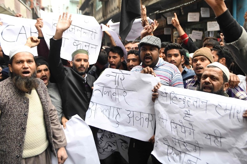 Relatives of Sam Stafford, 18, who was killed after police fired during a protest against the government's Citizenship Amendment Bill (CAB) a day before, react in Guwahati, Assam, on Friday. — AFP