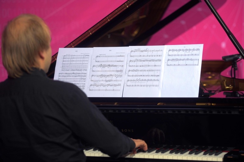 A piano player performs a part of the completion of Beethoven's 10th symphony made using artificial intelligence at the Telekom headquarters in Bonn, western Germany, on Friday. Telekom supports an experiment to complete the composer's 10th symphony using artificial intelligence and a team of international experts from science and music. A string quartet and a pianist perform two minutes of the AI composition live. — AFP