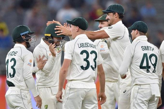 Australia's Mitchell Starc celebrates with teammates after picking up a wicket against New Zealand in the Pert Test on Sunday.
