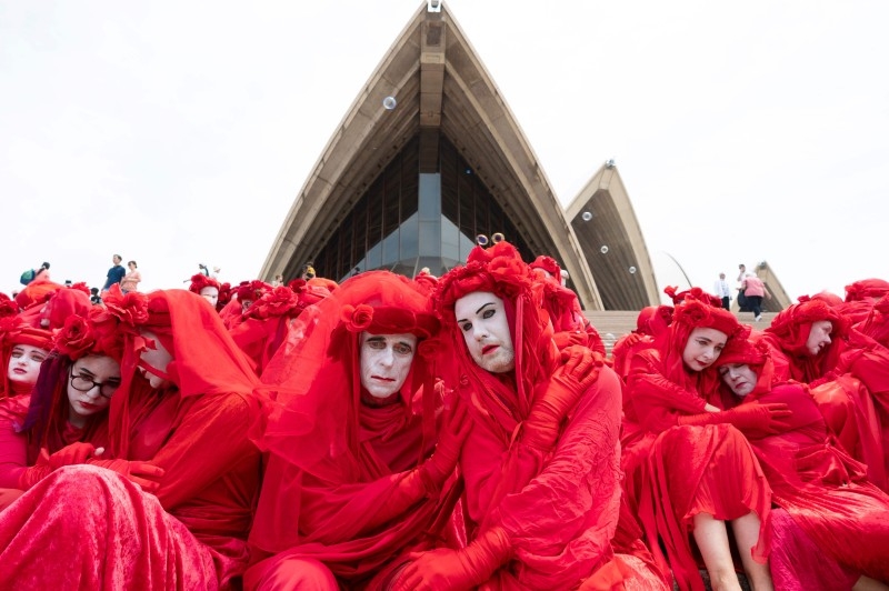The Red Rebels, part of the Extinction Rebellion Australia demonstrator group, participate in a climate protest rally in Sydney on Sunday. -AFP