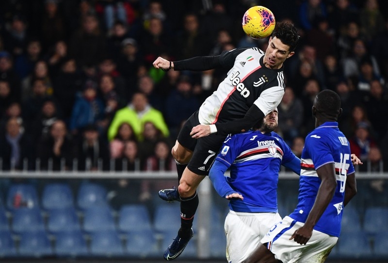 Juventus' Portuguese forward Cristiano Ronaldo scores a header during the Italian Serie A football match against Sampdoria on Wednesday at the Luigi-Ferraris stadium in Genoa. — AFP