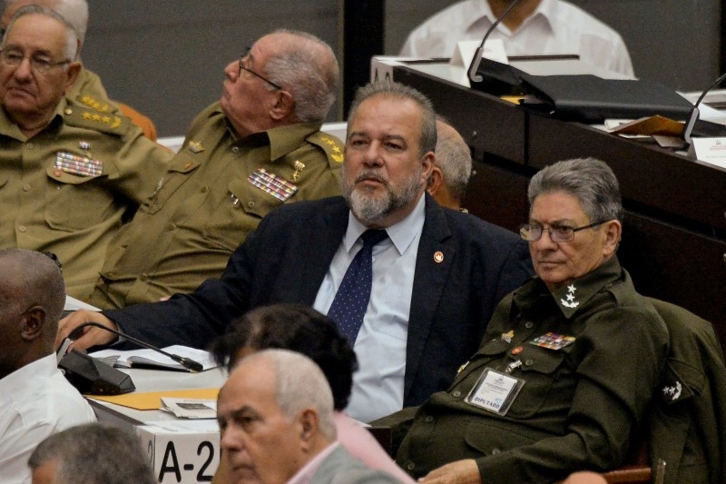 Newly appointed Cuban Prime Minister Manuel Marrero Cruz (C), attends the closing of the Fourth Regular Session of the National Assembly of Popular Power in its IX Legislature at the Convention Palace in Havana, on Saturday. -AFP