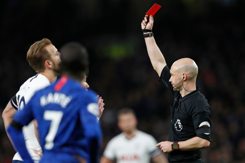 English referee Anthony Taylor, right, shows a red card to Tottenham Hotspur's South Korean striker Son Heung-Min during the English Premier League football match between Tottenham Hotspur and Chelsea at Tottenham Hotspur Stadium in London, in this Dec. 22, 2019 file photo. — AFP