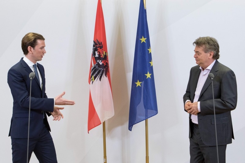 Head of the Austrian People's Party (OeVP) Sebastian Kurz (L) and head of the Green Party Werner Kogler (R) give a press conference in Vienna on Wednesday. Kurz said  that his conservatives and the Greens have got an 