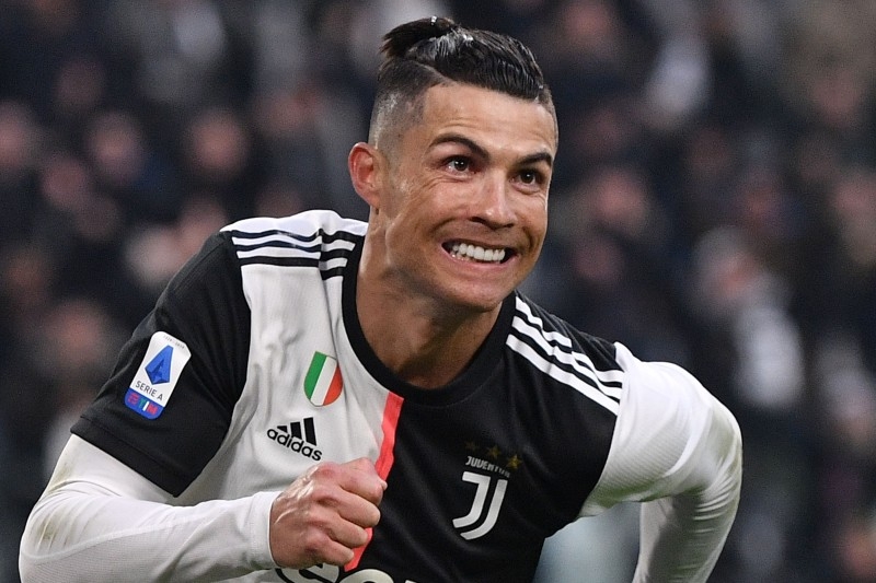 Juventus' Portuguese forward Cristiano Ronaldo celebrates after scoring his third goal during the Italian Serie A football match Juventus vs Cagliari on Monday at the Juventus Allianz stadium in Turin. — AFP
