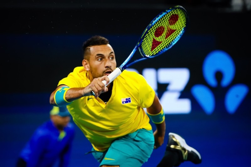 Nick Kyrgios of Australia hits a return against Stefanos Tsitsipas of Greece during the men's singles match on day five of the ATP Cup tennis tournament in Brisbane on Tuesday. — AFP