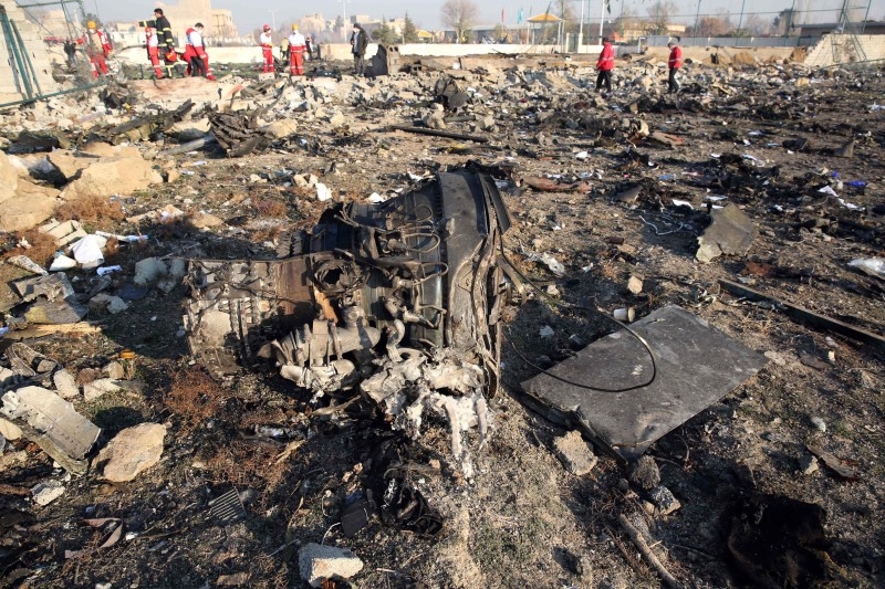 Rescue teams work at the scene after a Ukrainian plane carrying 176 passengers crashed near Imam Khomeini airport in the Iranian capital Tehran early on Wednesday morning, killing everyone on board. -AFP