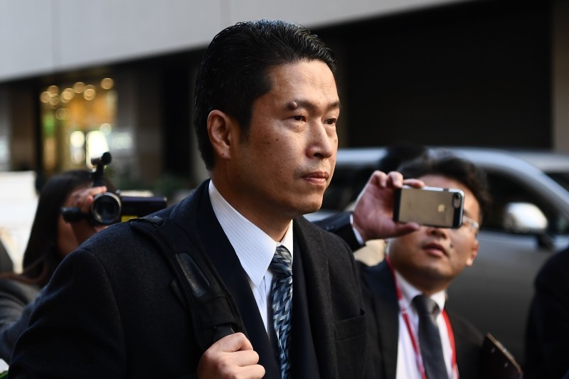Satoshi Uematsu's lawyer leaves the Yokohama District Court in Yokohama on Wednesday, after the first day of the trial of Satoshi Uematsu, accused of murdering 19 disabled people at a care facility in the town of Sagamihara in 2016. -AFP