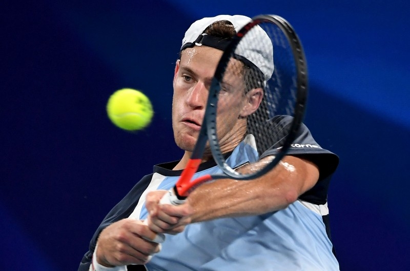 Diego Schwartzman of Argentina hits a backhand return in his men's singles match against Dominic Thiem of Austria at the ATP Cup tennis tournament in Sydney on Wednesday. —  AFP 