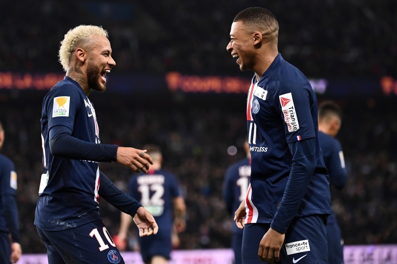 Paris Saint-Germain's Brazilian forward Neymar (L) celebrates with Paris Saint-Germain's French forward Kylian Mbappe (R) after scoring a goal during the French League cup final quarterfinal match against AS Saint Etienne at the Parc des Princes stadium in Paris on Wednesday. — AFP