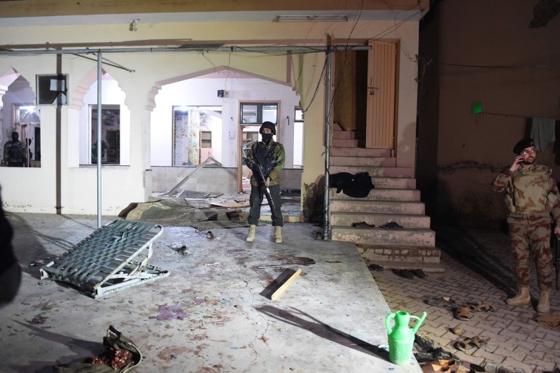 Security officials examine the site after a bomb blast in a mosque in Quetta on Friday. — AFP