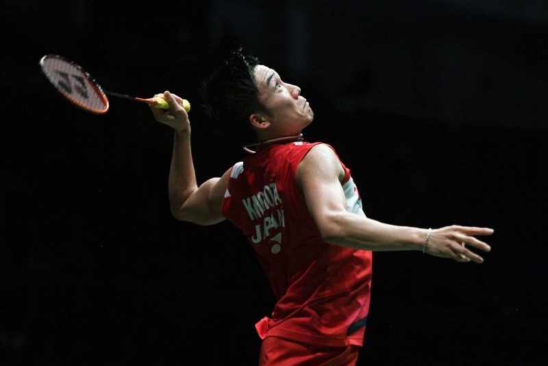 Japan's Kento Momota eyes a return against China's Huang Yuxiang during their men's singles quarterfinal match at the Malaysia Open badminton tournament in Kuala Lumpur on Jan. 10, 2020. — AFP