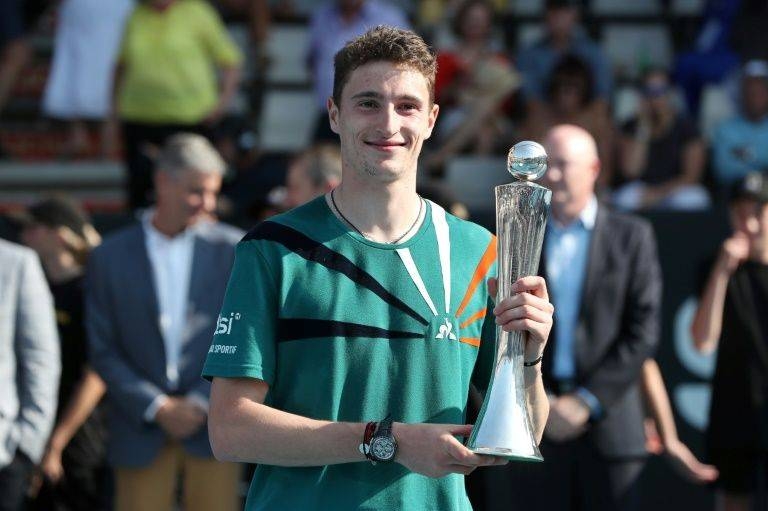 The unseeded Ugo Humbert held his nerve in the deciding tie-break of his first ATP final to win against Benoit Paire. — AFP