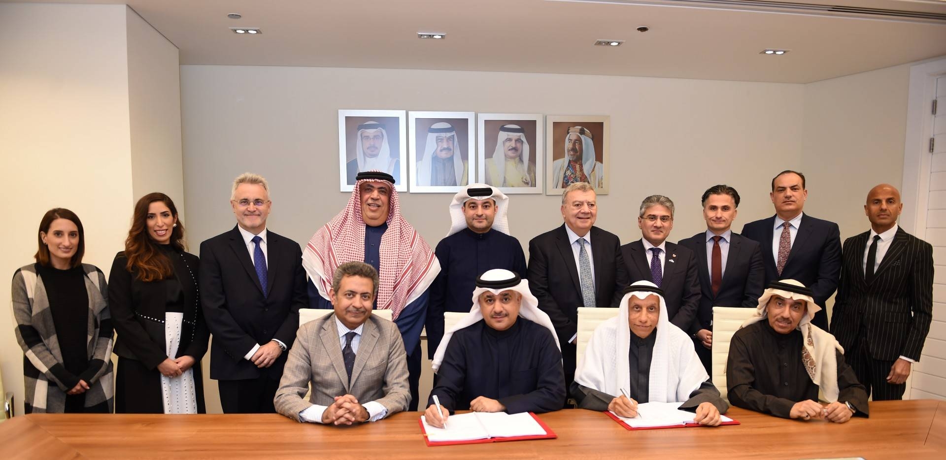 Officials of signatory companies pose for a group photo