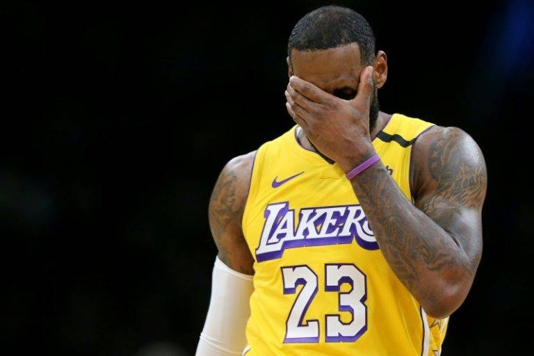 Los Angeles star LeBron James reacts during the Lakers' blowout NBA loss to the Boston Celtics. — AFP