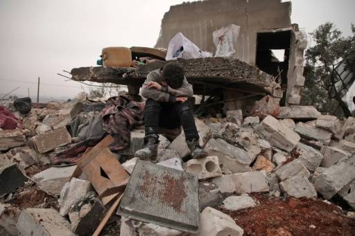 A Syrian boy cries in the village of Kafr Taal where nine children are reported to have been killed in two days of airstrikes. — Courtesy photo            