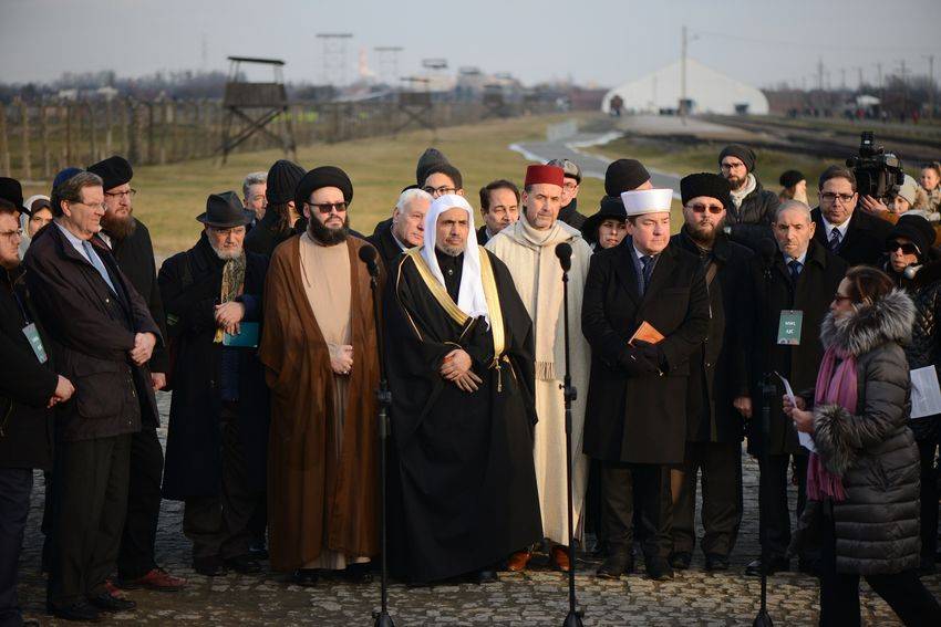 Dr Mohammad Abdulkarim Al-Issa (C), secretary general of the Muslim World League (MWL) speaks at a candle-lighting ceremony at the memorial monument in the former German Nazi death camp Auschwitz-Birkenau on Thursday. — AFP