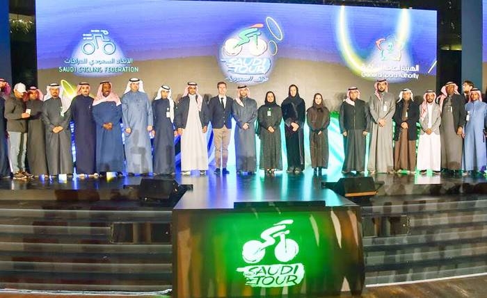 Members of the organizations set to conduct the Saudi Tour 2020 cycle race in Riyadh pose for a family photo at the press conference.