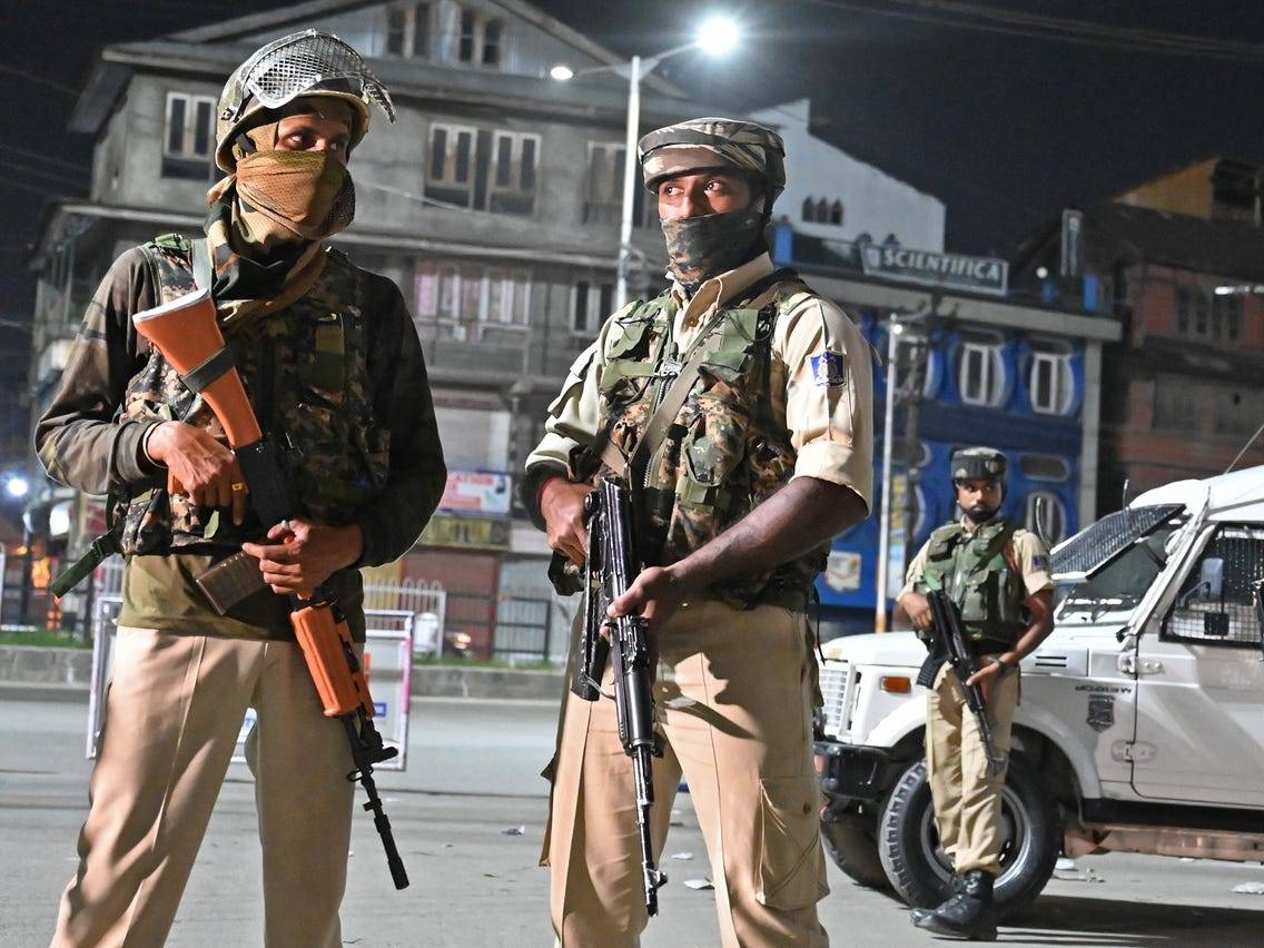 Indian paramilitary troopers stand guard at a roadblock in Kashmir in this file photo. — AFP