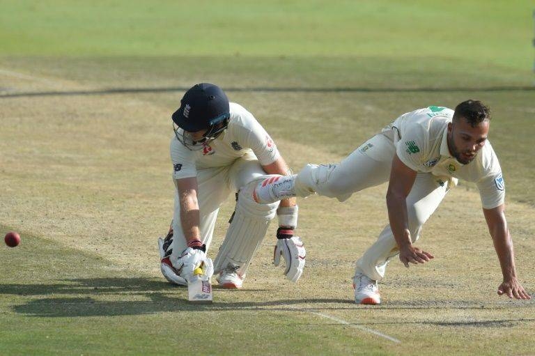 England's Joe Root dives for the crease despite presence of South Africa's Dane Paterson. — AFP