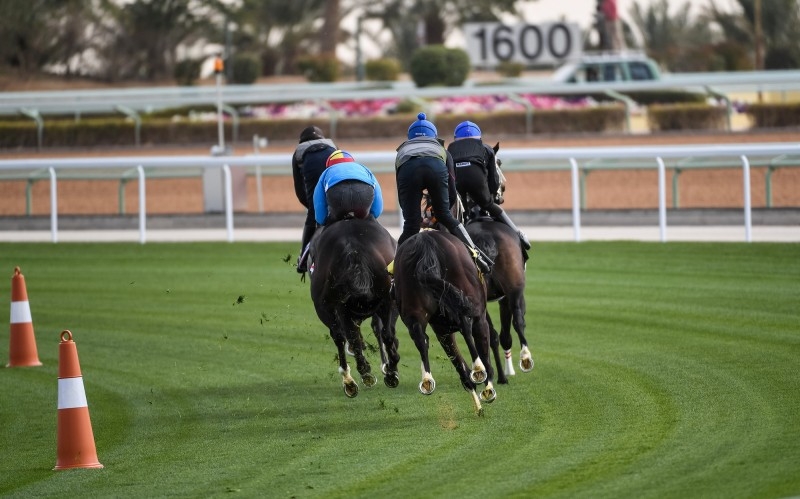 Prince Bandar Bin Khalid Al Faisal, chairman of the Jockey Club of Saudi Arabia, with jockeys ahead of the Turf Trial in Riyadh.