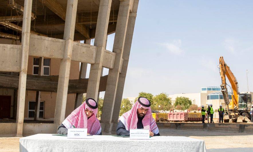 Prince Badr Bin Abdullah Bin Farhan, right, signs an agreement with MBC Group Chairman Sheikh Waleed, left, to establish new headquarters in Riyadh. — Courtesy photo