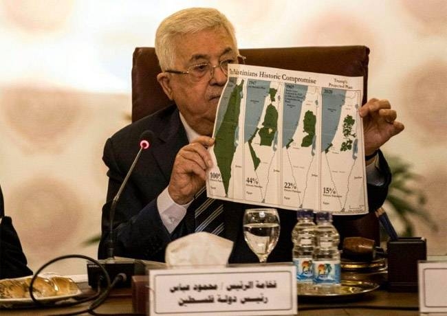 Palestinian president Mahmoud Abbas shows maps of historical Palestine during a February 2020 Arab League meeting on President Donald Trump's proposed Middle East plan. — AFP
