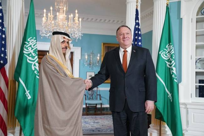 Minister of Foreign Affairs Prince Faisal Bin Farhan shakes hands with US Secretary of State Mike Pompeo at the State Department headquarters in Washington on Wednesday. — SPA