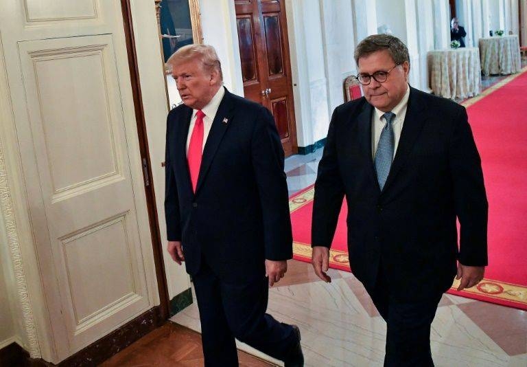 US President Donald Trump, left, and Attorney General William Barr have come under fire for intervening in the case of Trump friend Roger Stone. — AFP 
