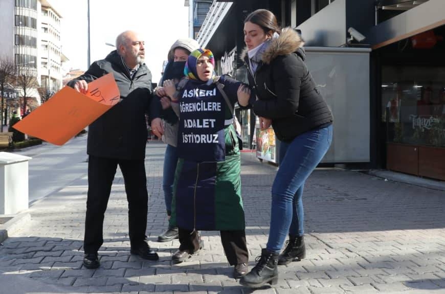 Melek Cetinkaya (center) is detained by police in Anakra as she demonstrates for her son who has been in prison for over three years. — Courtesy photo