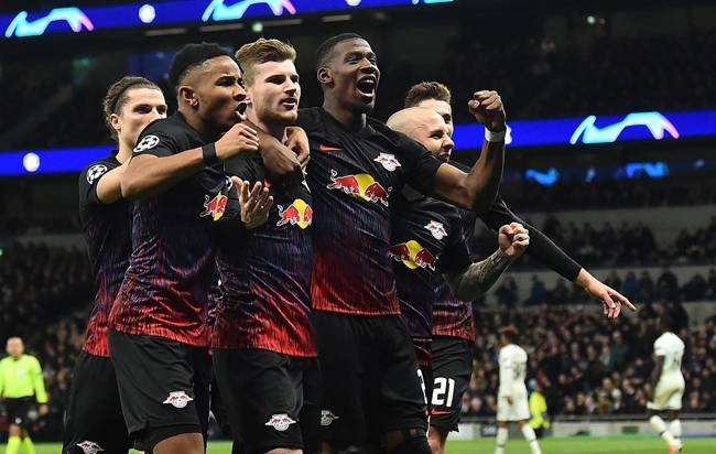 RB Leipzig players celebrate after their 1-0 first leg Champions League win over Tottenham in London on Wednesday. — AFP