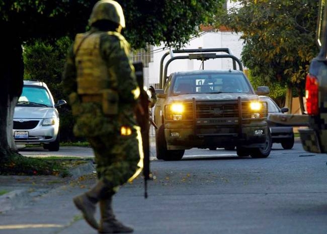 Mexican soldiers pictured taking part in a military operation in January 2014 during which Ruben Oseguera Gonzalez was arrested. — AFP 