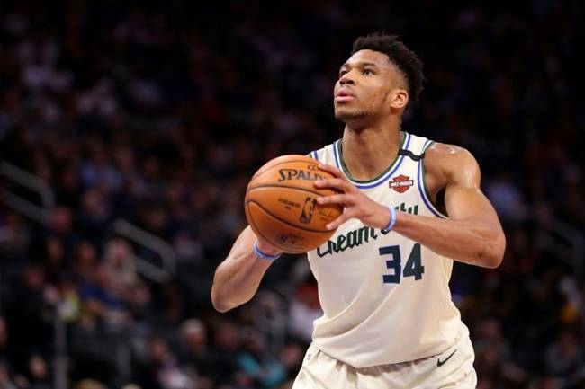 Milwaukee Bucks star Giannis Antetokounmpo shoots a free throw while playing the Detroit Pistons during the second half at Little Caesars Arena in Detroit. — AFP 