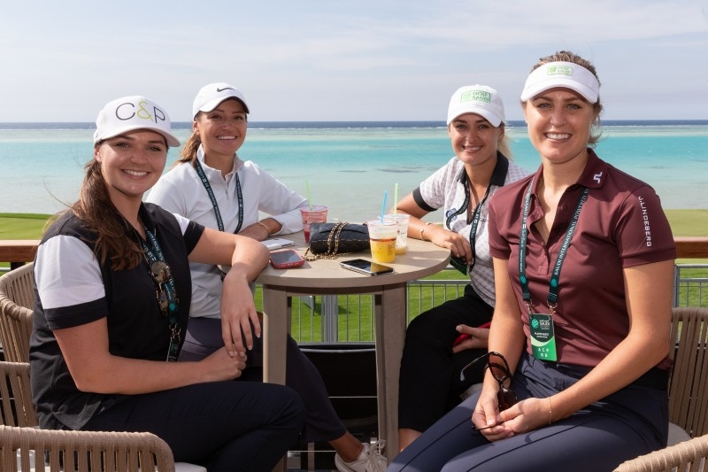 Amy Boulden and Rachel Drummond pose with Brooks Koepka. — Courtesy photos