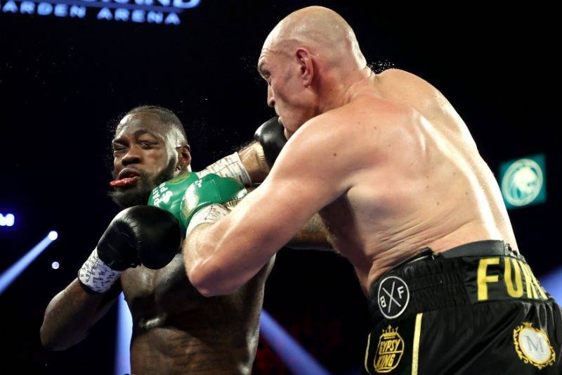 Tyson Fury, right, punches Deontay Wilder during their Heavyweight bout for Wilder's WBC and Fury's lineal heavyweight title at MGM Grand Garden Arena in Las Vegas, Nevada, on Saturday. — Courtesy photo 