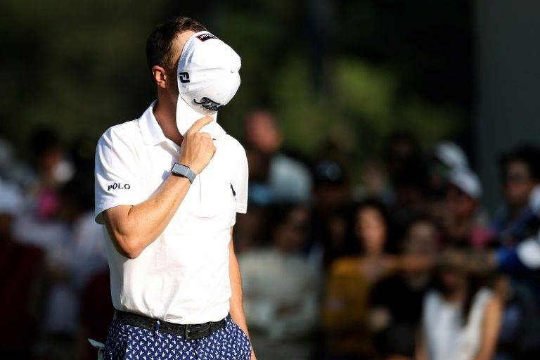American Justin Thomas reacts to a par putt miss at the 18th hole on Saturday in the third round of the WGC Mexico Championship. — AFP

