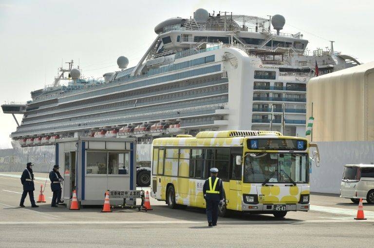 Passengers from the Diamond Princess were taken by stations and airports to begin the journeys home. — AFP